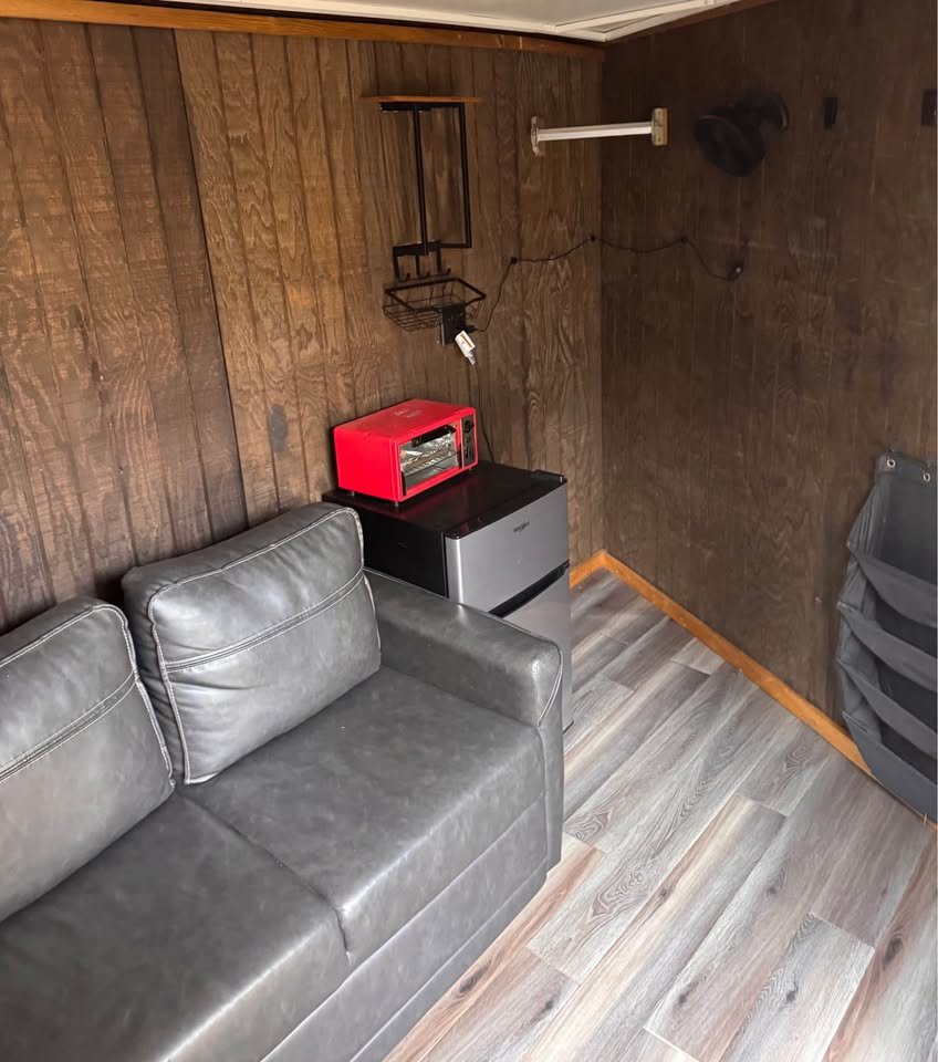 The carpeted gooseneck nose area provides a comfortable sleeping space for weekend horse shows