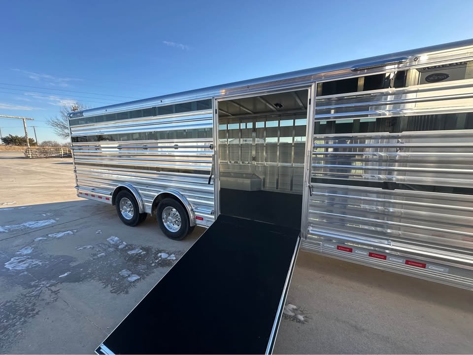 Heavy-duty radial tires and tandem axles on a 30-foot professional livestock trailer.