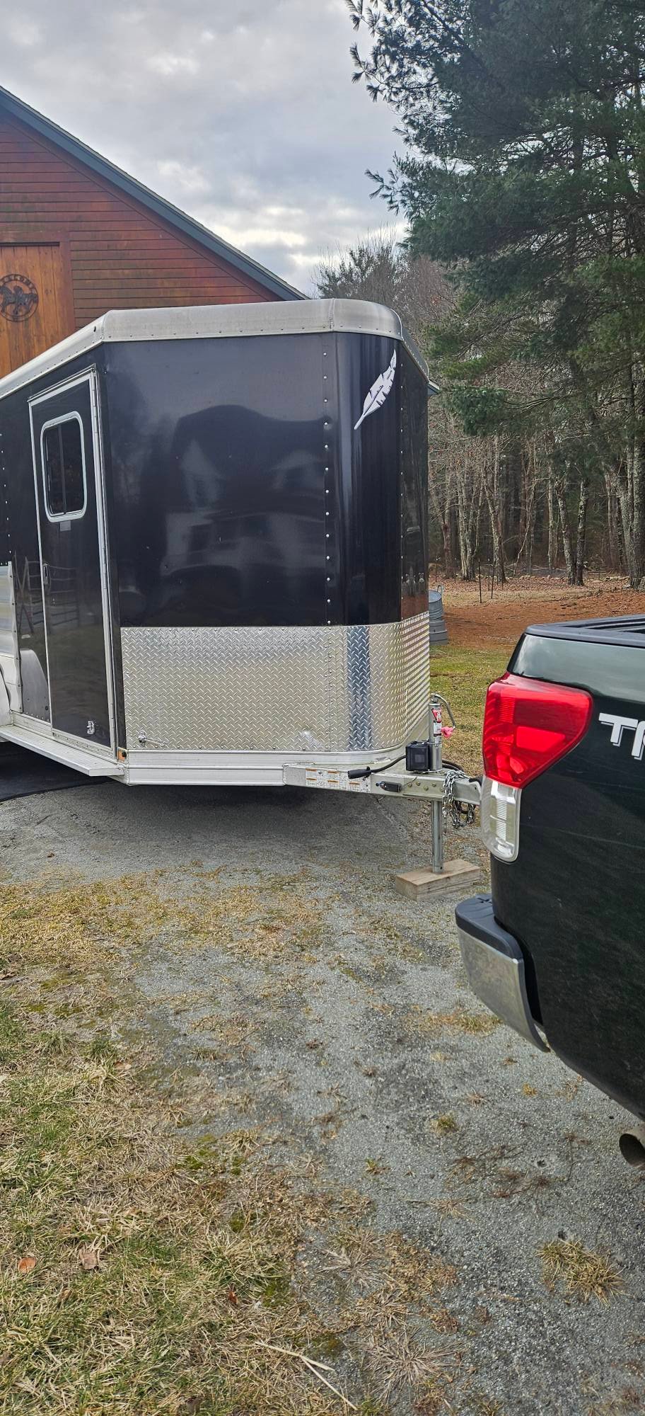 A front angle showing the aerodynamic v-nose profile and heavy-duty bumper pull coupler