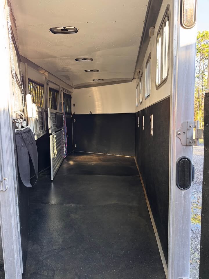 View of the four-horse slant stalls with padded dividers and insulated aluminum walls